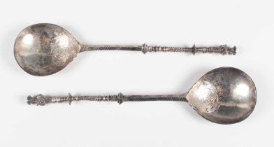A pair of early 20th century Dutch silver apostle spoons, each fig shaped bowl with engraved