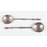 A pair of early 20th century Dutch silver apostle spoons, each fig shaped bowl with engraved