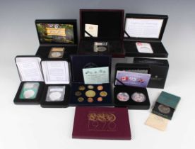 A collection of various commemorative coins, including a Harrington & Byrne one-ounce silver