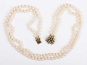 A two row necklace of uniform cultured pearls on a gold and turquoise clasp, detailed ‘14K’,