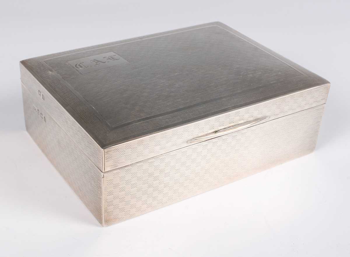 A George VI silver rectangular engine turned cigarette case, Birmingham 1948 by A. Nicholls & Son - Image 6 of 7