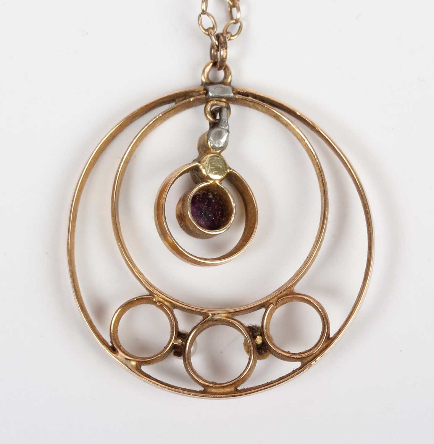 A gold, amethyst and seed pearl pendant in an openwork design, unmarked, weight 2.3g, length 3cm, - Image 3 of 3