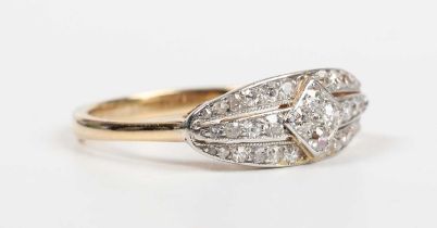A gold and diamond ring in an oval panel shaped design, mounted with circular cut diamonds,