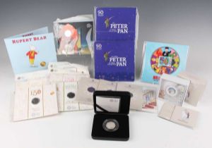 A collection of Elizabeth II Royal Mint silver proof and Brilliant Uncirculated fifty pences,