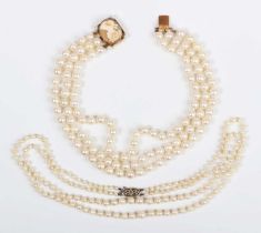 A three row choker of uniform cultured pearls on a gold, shell cameo and cultured pearl clasp,