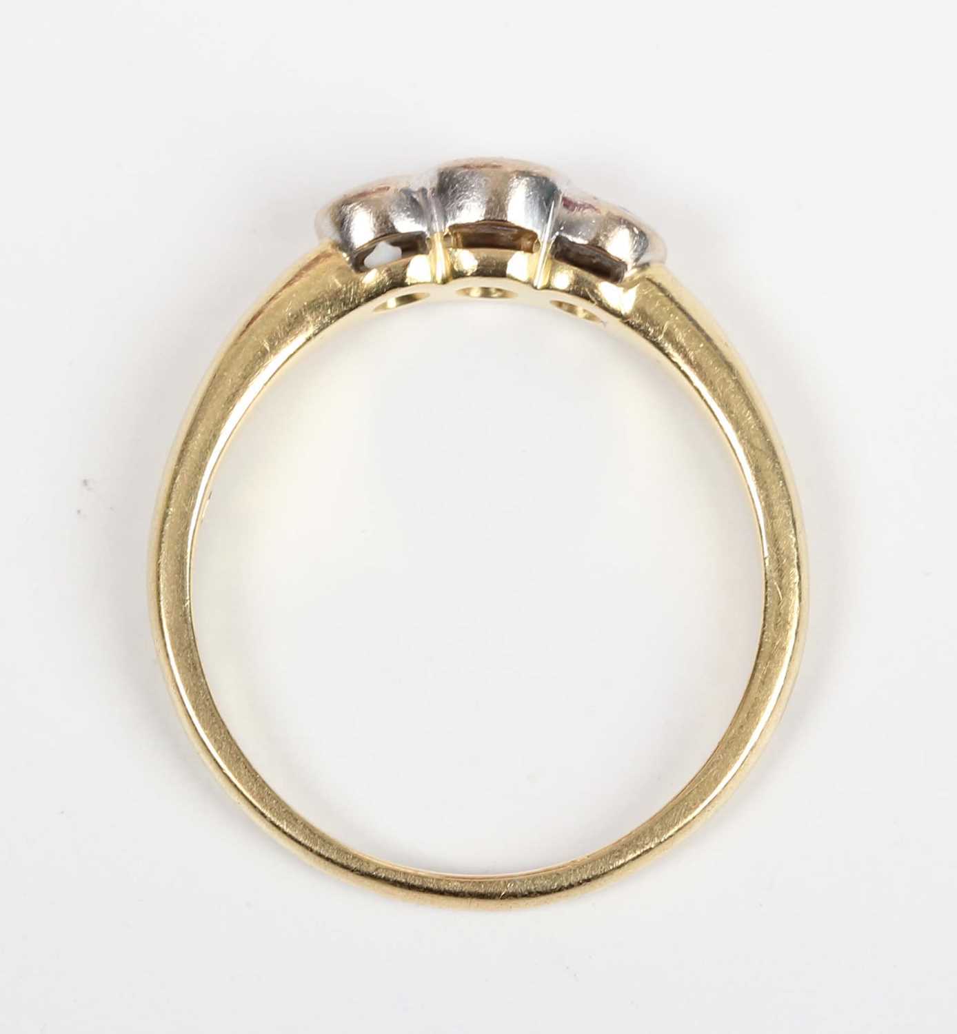 An 18ct gold and diamond three stone ring, collet set with a row of circular cut diamonds, Sheffield - Image 4 of 5