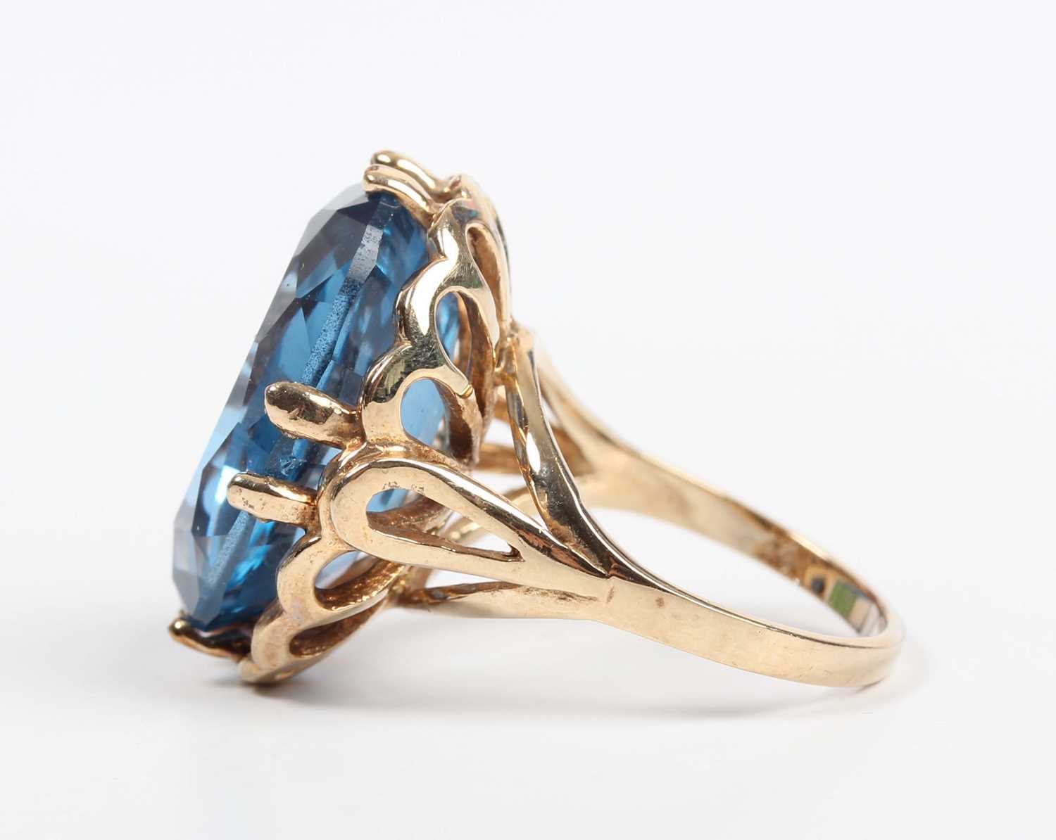 A 9ct gold ring, claw set with a large oval cut synthetic blue spinel, London 2009, weight 9g, - Image 3 of 5