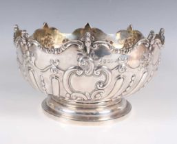 A late Victorian silver monteith style rose bowl, the front embossed with a vacant 'C' scroll