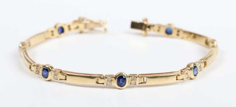 A gold, sapphire and diamond bracelet, mounted with oval cut sapphires between pairs of circular cut