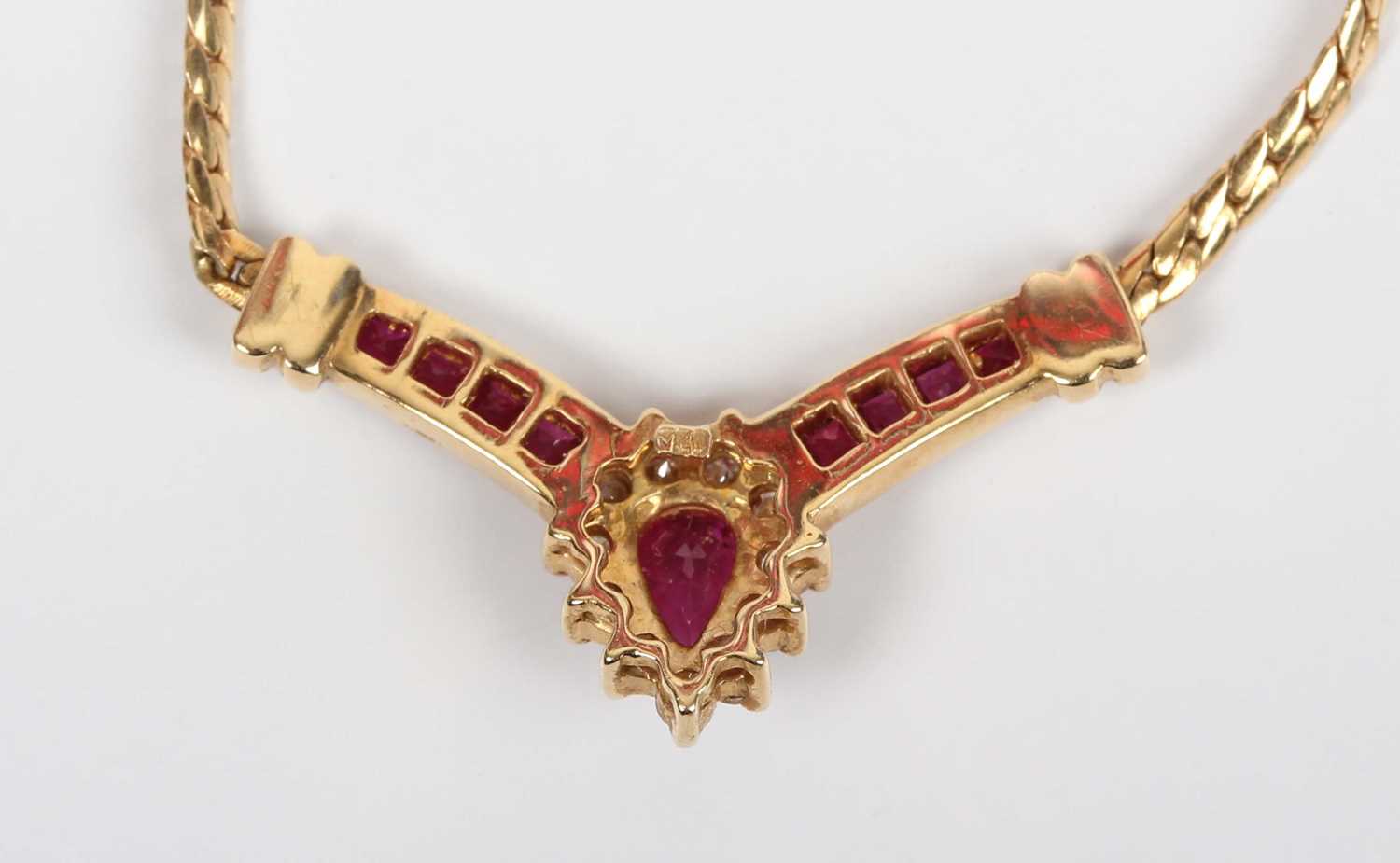 An 18ct gold, ruby and diamond necklace, the front in a ‘V’ shaped design, the principal pear shaped - Image 3 of 3