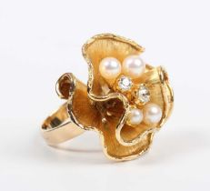 A gold, diamond and cultured pearl ring, mounted with two old cut diamonds and four cultured pearls,