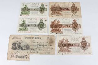 A group of three George V one pound notes, comprising two Chief Cashier N.K. Warren Fisher and one
