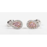 A pair of 18ct white gold, pink sapphire and diamond earstuds, each in a drop shaped design, mounted