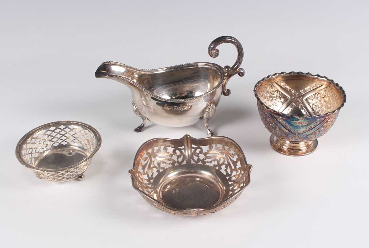 A small group of silver, comprising a sauce boat with beaded rim, London 1973, a sugar bowl,