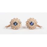 A pair of French gold, sapphire, diamond and half-pearl cluster earrings, each collet set with a