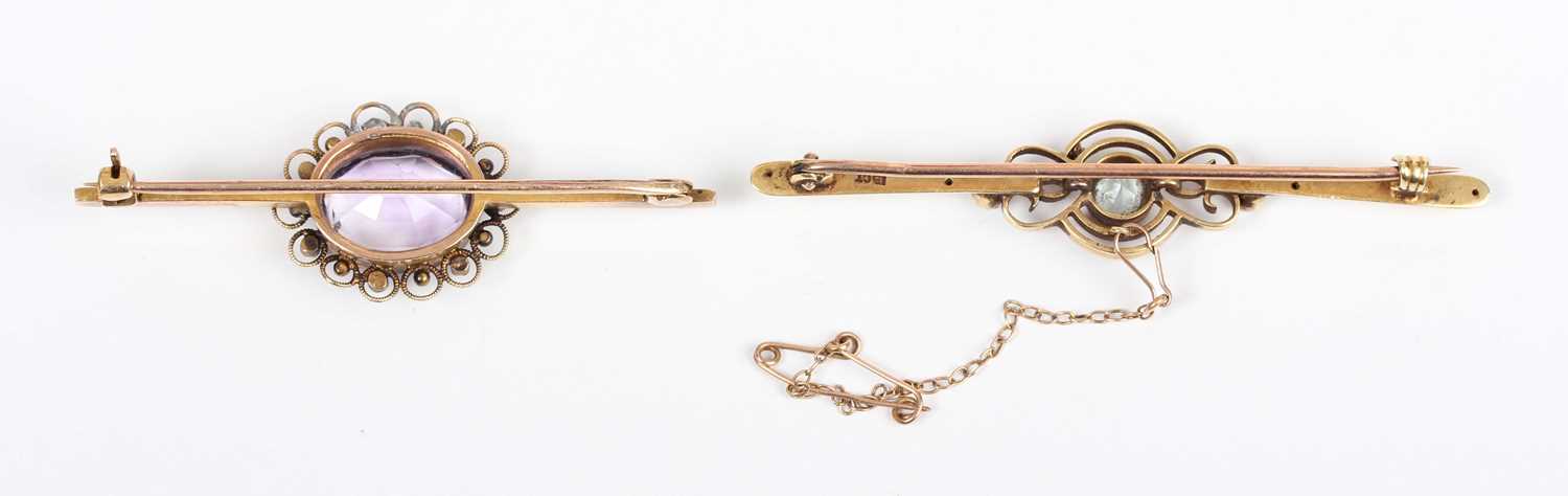 A gold, aquamarine and seed pearl bar brooch, detailed '15ct', fitted with a safety chain, weight - Image 2 of 2