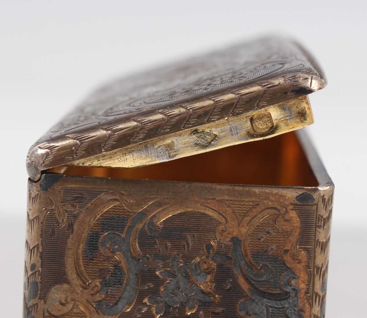 A 19th century French silver and parcel gilt rectangular snuff box, engraved with flowers and - Image 5 of 10