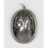 A silver and plique-à-jour enamelled oval pendant, designed as the portrait of the Virgin Mary