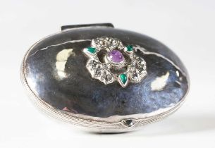 An early 20th century Arts and Crafts silver oval box by the Artificers' Guild, London 1911, the