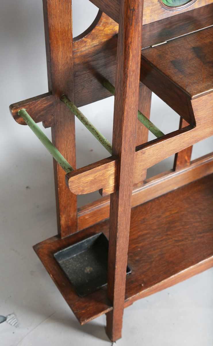 An Edwardian Arts and Crafts Glasgow School oak hallstand, the mirrored back inset with glazed - Image 11 of 13