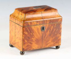 A Regency tortoiseshell tea caddy with overall metal stringing, the pagoda moulded lid revealing two