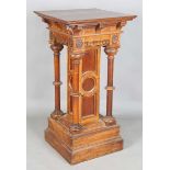A large late Victorian Gothic Revival oak pedestal, the frieze carved with rosette medallions