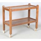 A Robert 'Mouseman' Thompson workshop oak two-tier trolley, one upright carved with mouse signature,