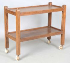 A Robert 'Mouseman' Thompson workshop oak two-tier trolley, one upright carved with mouse signature,