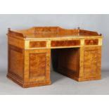 A 20th century Biedermeier style maple twin pedestal desk, the three-quarter gallery back above