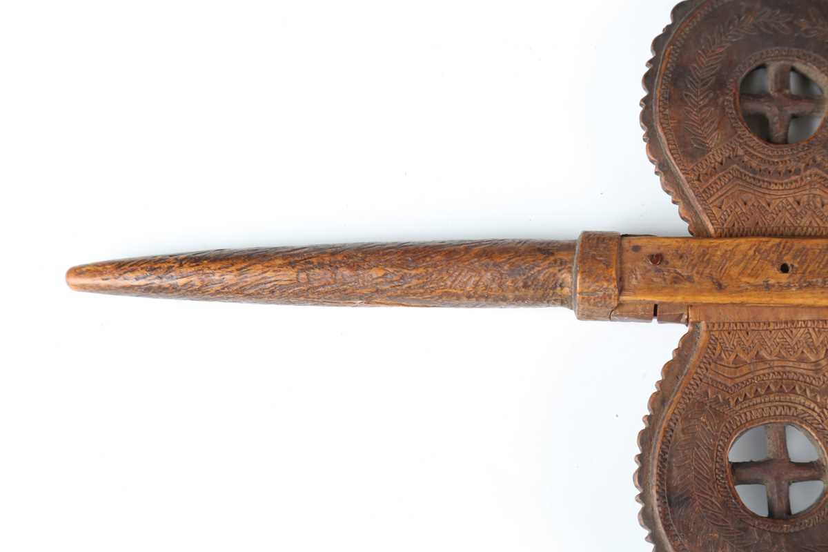 A 19th century patinated treen distaff, probably Greek, the shaped crosspiece finely incised with - Image 9 of 12