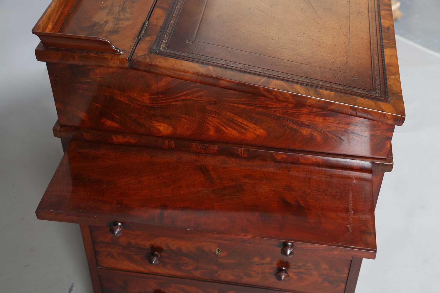 A good early Victorian flame mahogany Davenport, the hinged writing slope inset with tooled - Image 7 of 12