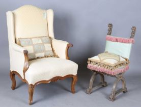 A mid-20th century French walnut showframe armchair, upholstered in yellow fabric, height 111cm,
