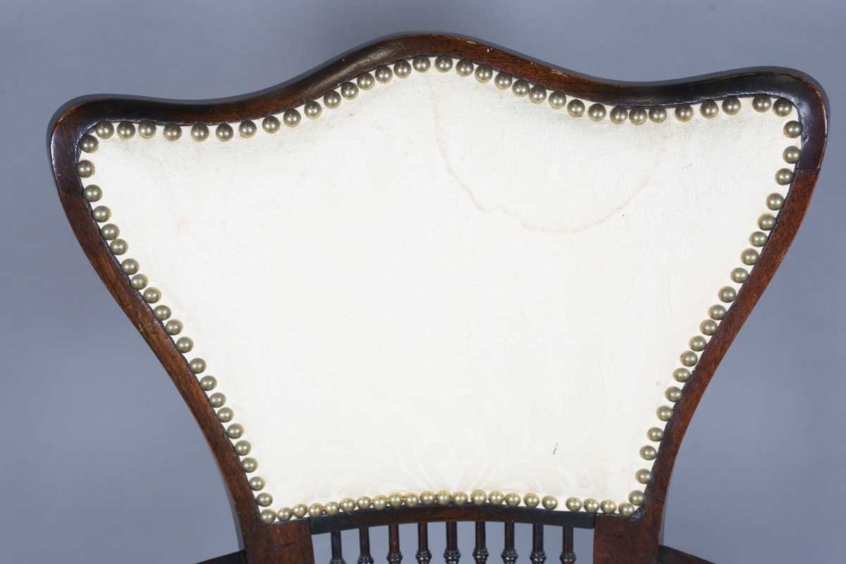 An Edwardian Arts and Crafts style stained walnut showframe armchair, upholstered in cream fabric, - Image 2 of 17