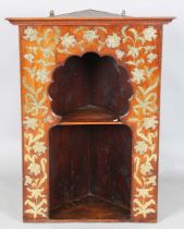 A late 19th century Aesthetic Movement Moorish walnut corner display shelf, the arched niche