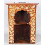 A late 19th century Aesthetic Movement Moorish walnut corner display shelf, the arched niche