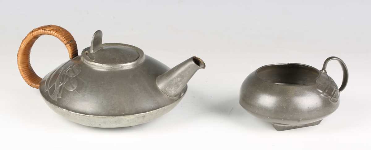 A Liberty & Co 'Tudric' pewter teapot and matching sugar bowl, model number '0231', designed by