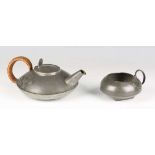 A Liberty & Co 'Tudric' pewter teapot and matching sugar bowl, model number '0231', designed by
