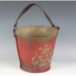 A late 18th/19th century painted leather fire bucket with strap handle and transfer printed royal
