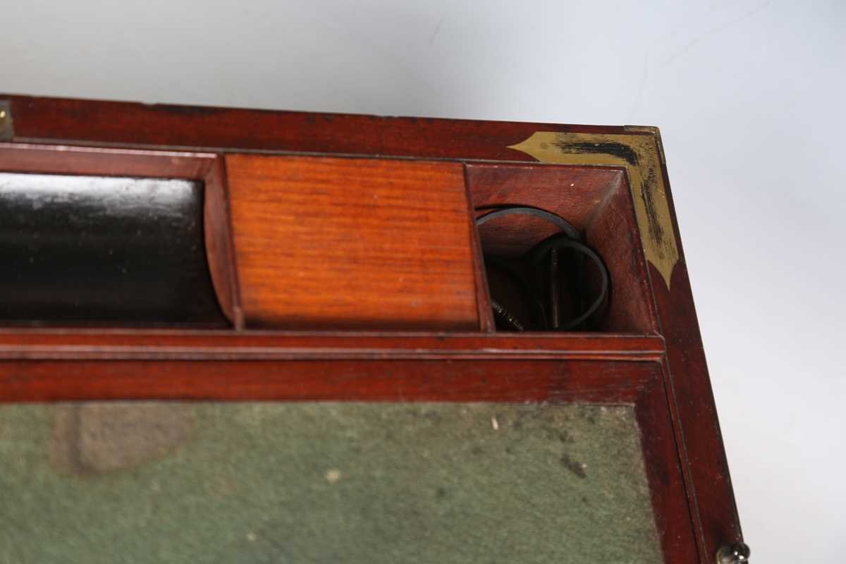 A late George III mahogany and gilt brass bound campaign style writing slope, the sides with brass - Image 4 of 15