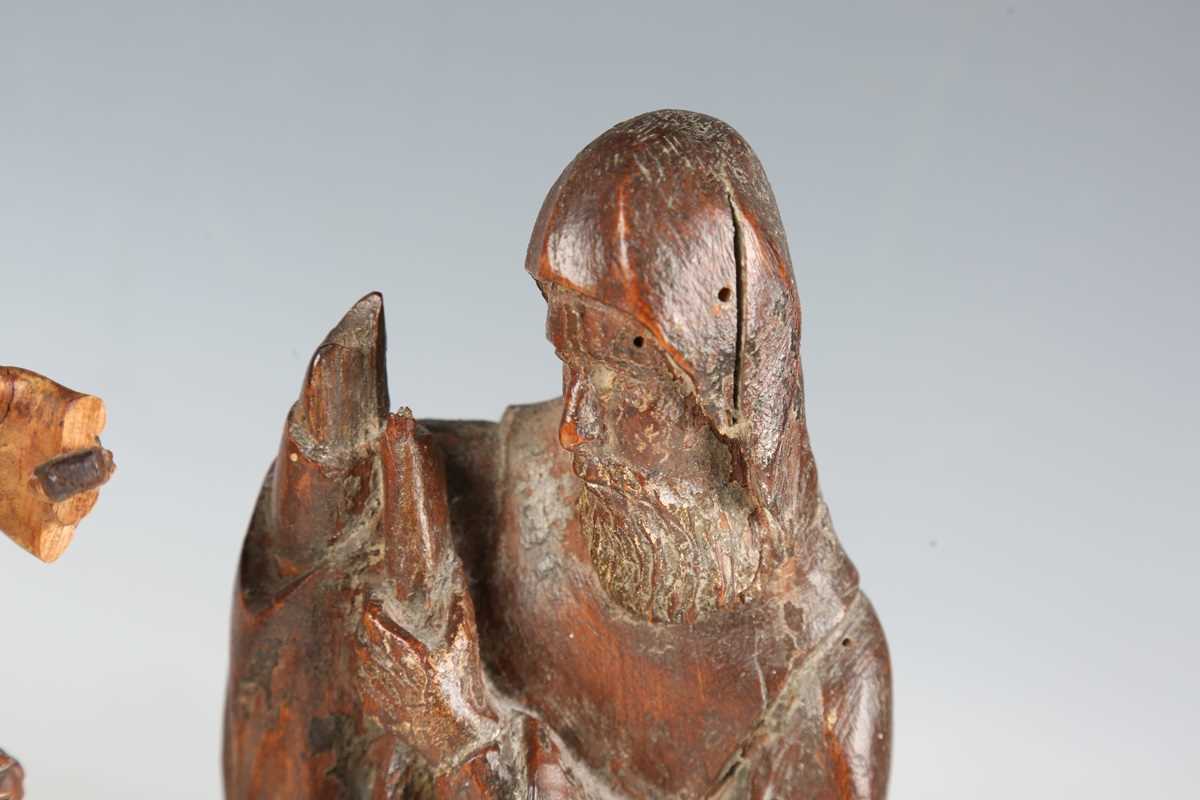 A Continental carved wooden figure of a saint, 16th/17th century, modelled holding a staff, length - Bild 5 aus 15