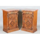 A pair of late Victorian Aesthetic Movement oak cabinets, in the manner of Charles Bevan, the