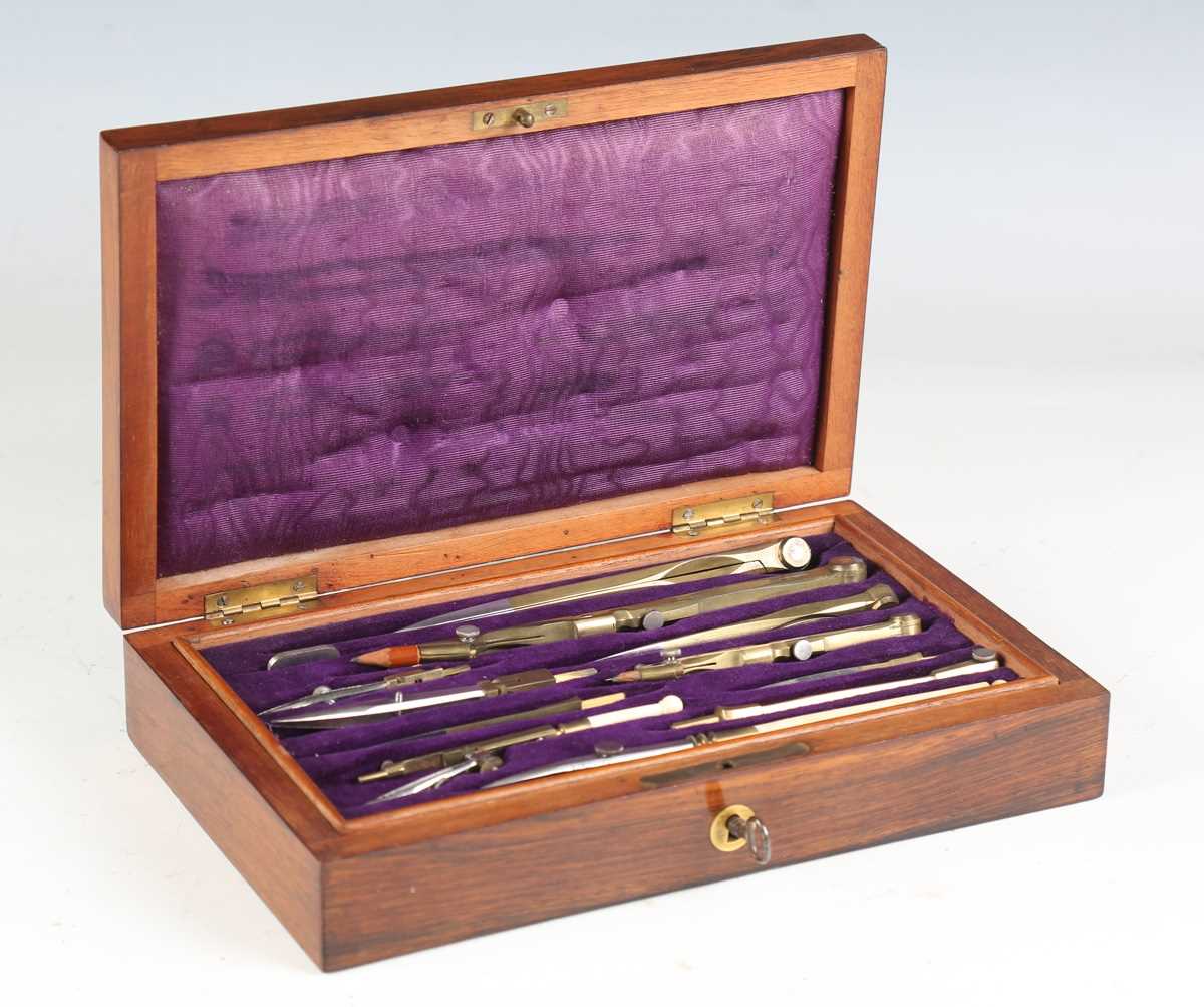 A Victorian rosewood cased part drawing instrument set, together with a boxwood rule and an ebony