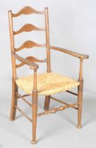 An Edwardian Arts and Crafts oak framed elbow chair, in the manner of William Birch, height 107cm,