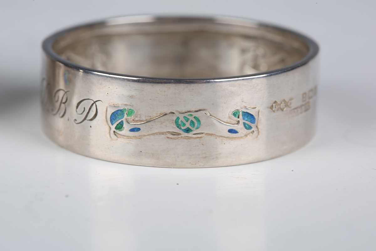 A pair of Liberty & Co 'Cymric' silver and enamelled napkin rings, Birmingham 1902, diameter 4. - Image 5 of 18