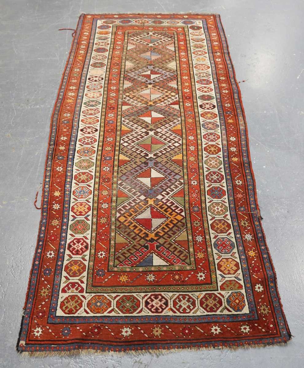 A Kazak runner, Caucasus, early 20th century, the polychrome field with a column of hooked