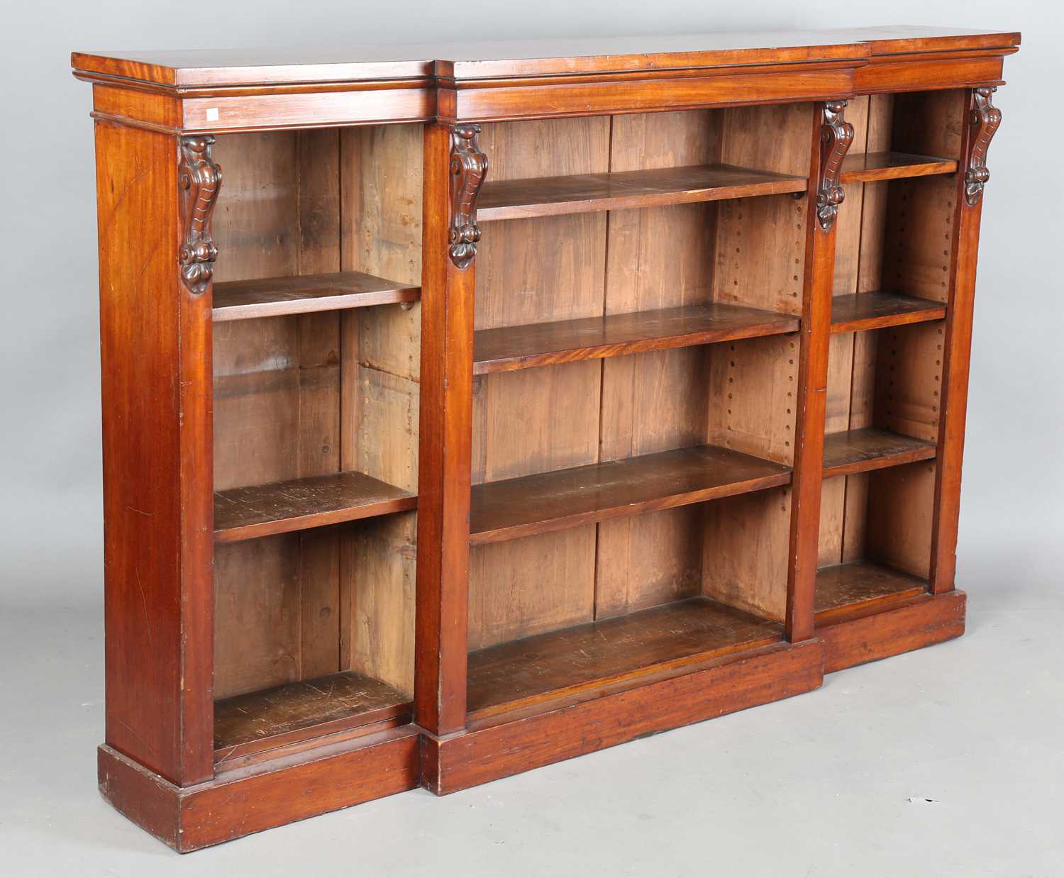 A Victorian mahogany breakfront three-section open bookcase, on a plinth base, height 118cm, width