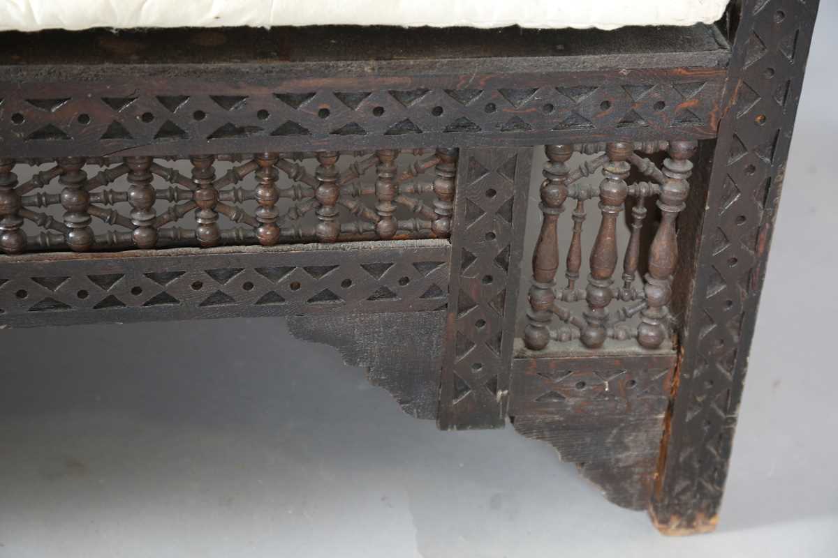 An early 20th century Middle Eastern softwood daybed, similar to those retailed by Liberty & Co, - Image 5 of 15