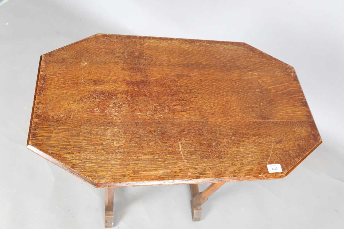 An early 20th century Arts and Crafts style oak canted rectangular occasional table, raised on - Image 2 of 6
