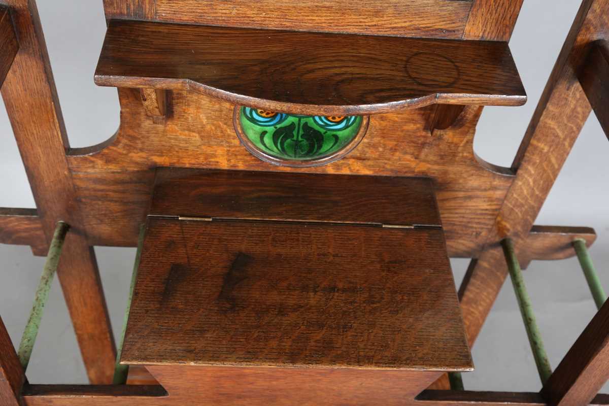 An Edwardian Arts and Crafts Glasgow School oak hallstand, the mirrored back inset with glazed - Image 7 of 13