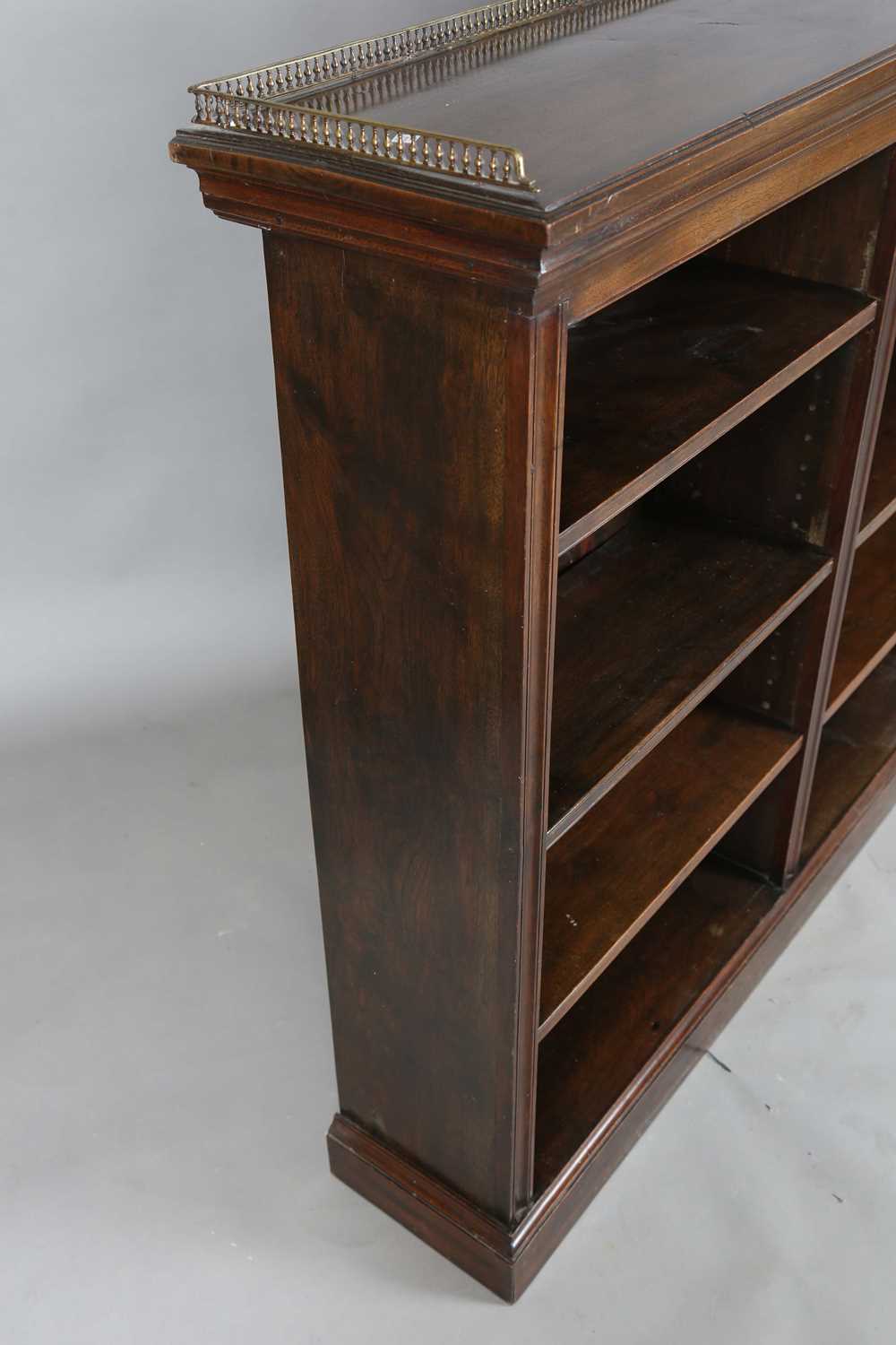 An Edwardian walnut two-section open bookcase with a brass three-quarter gallery, on a plinth - Image 9 of 11